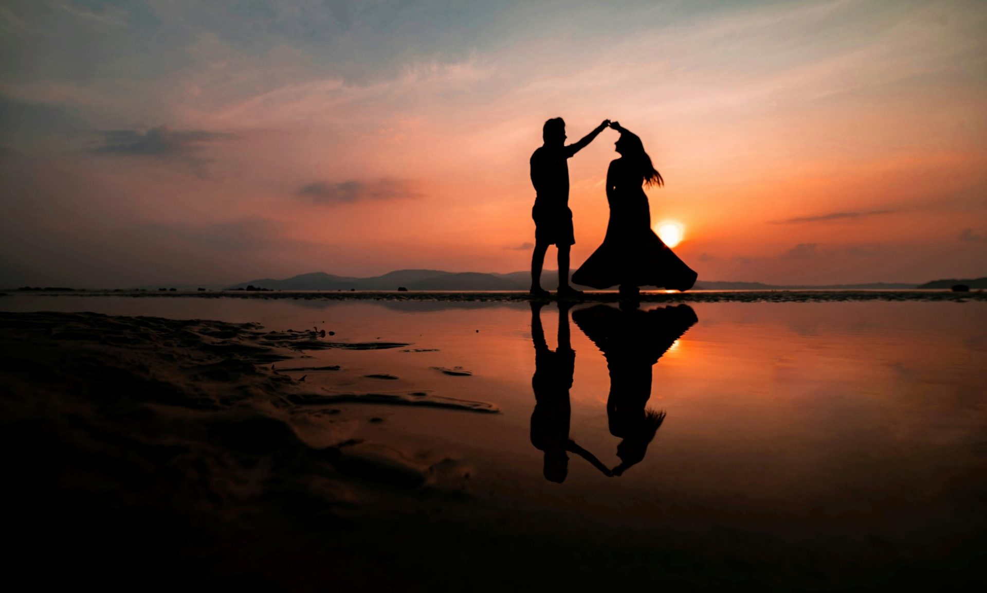 Couple dancing at sunset on an Andaman beach